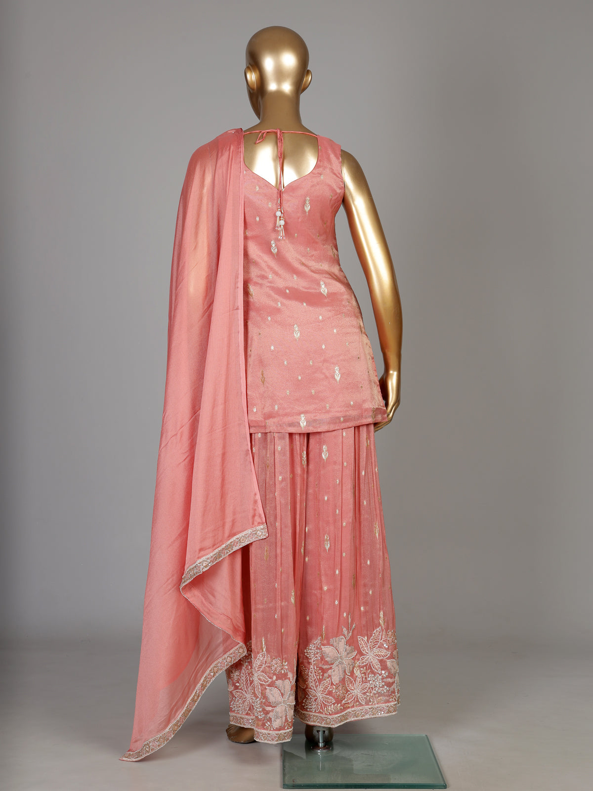 Pastel peach silk palazzo suit with pearl and zari detailing