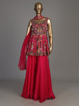Rani pink silk palazzo suit with mirror work and net dupatta