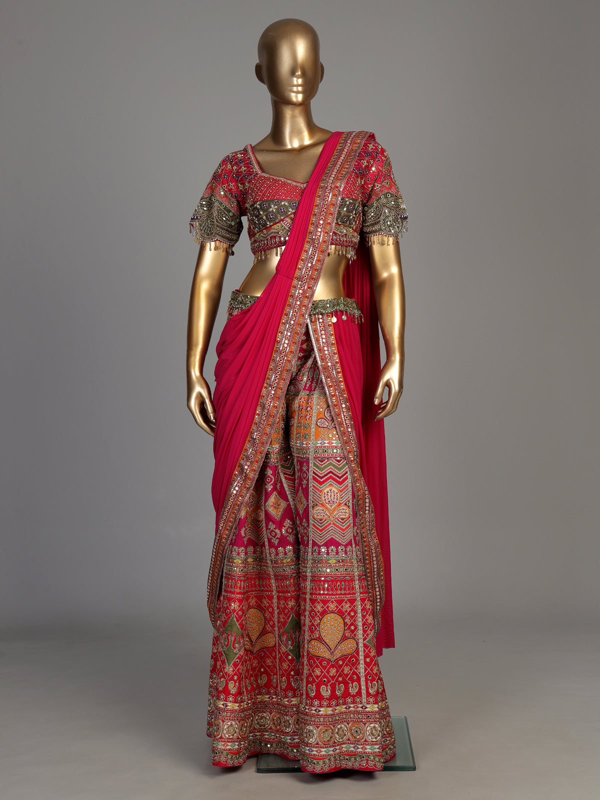 Rani pink silk palazzo suit with an embellished georgette dupatta