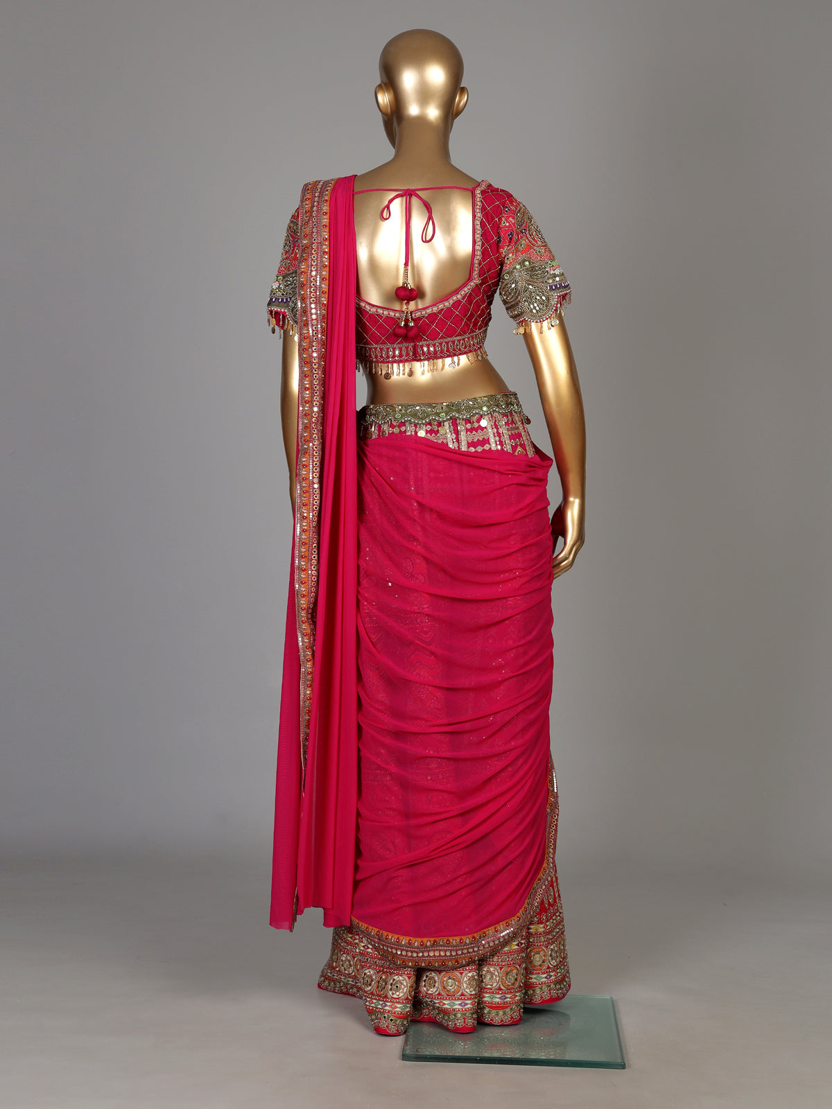 Rani pink silk palazzo suit with an embellished georgette dupatta
