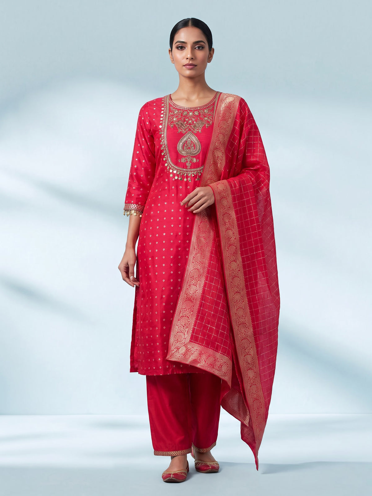 Rani pink silk bandhani suit with an embellished yoke