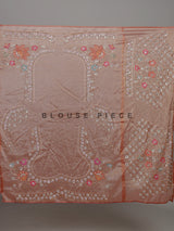 Pastel peach tissue silk saree with floral cutdana and tassels