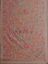 Pastel peach tissue silk saree with floral cutdana and tassels