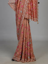 Pastel peach tissue silk saree with floral cutdana and tassels