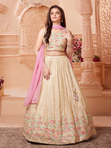 Beige silk lehenga choli with regal embellishments