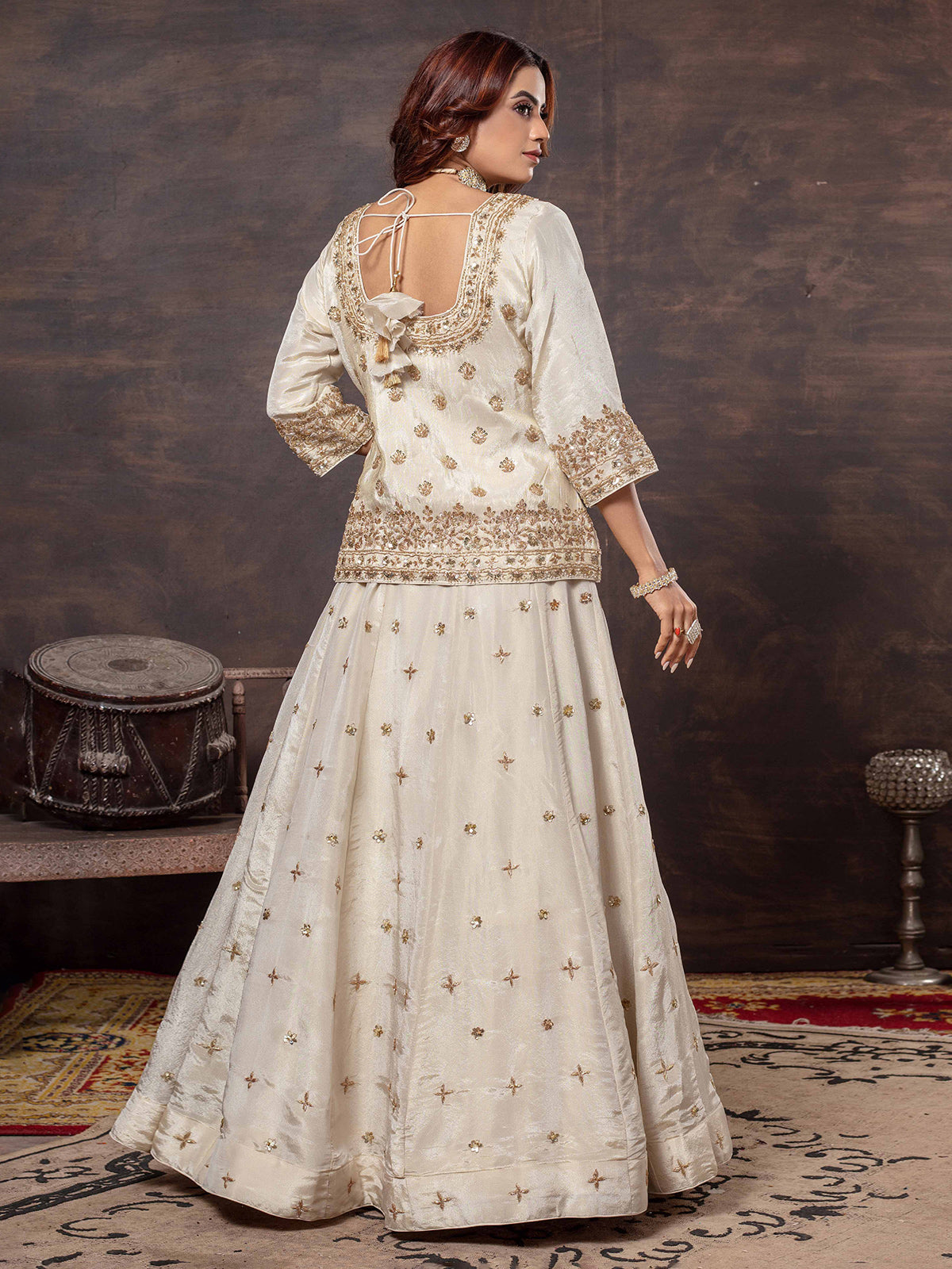 Beige tissue silk lehenga choli with round neck