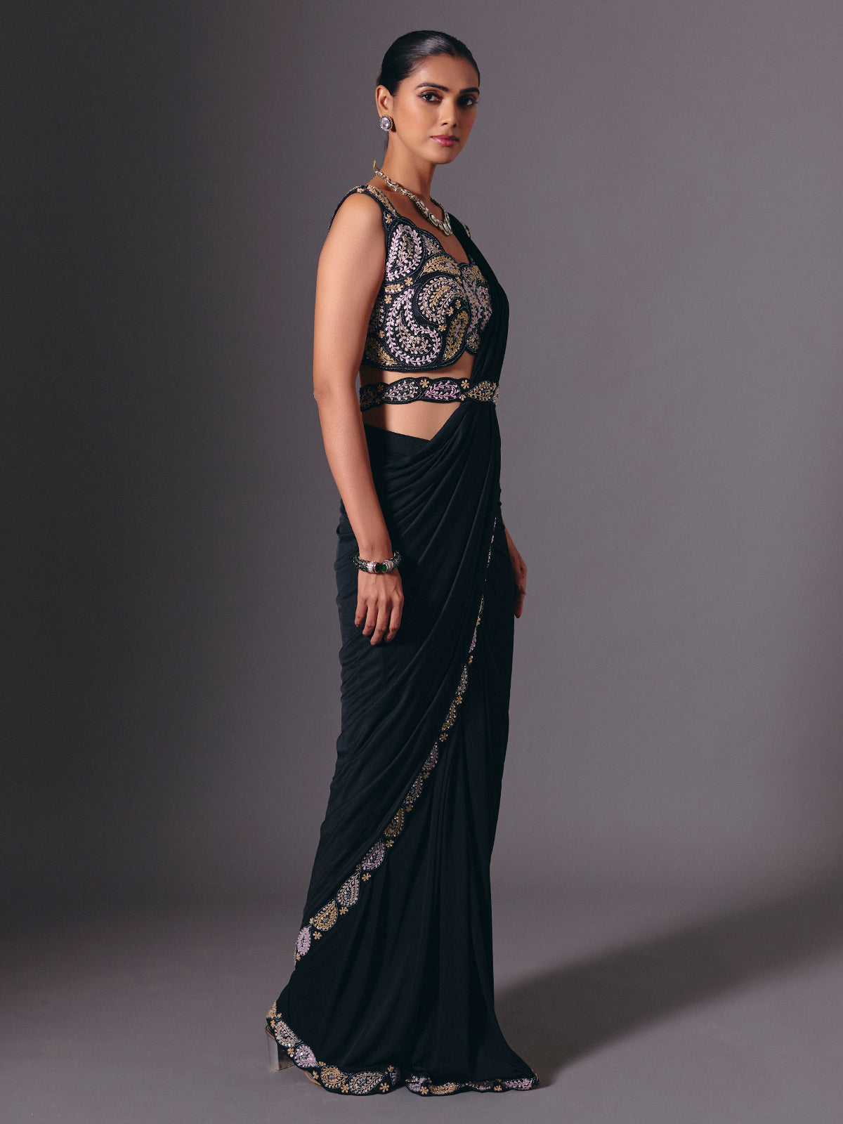 Black cruss lycra saree with sparkling bead embellishments