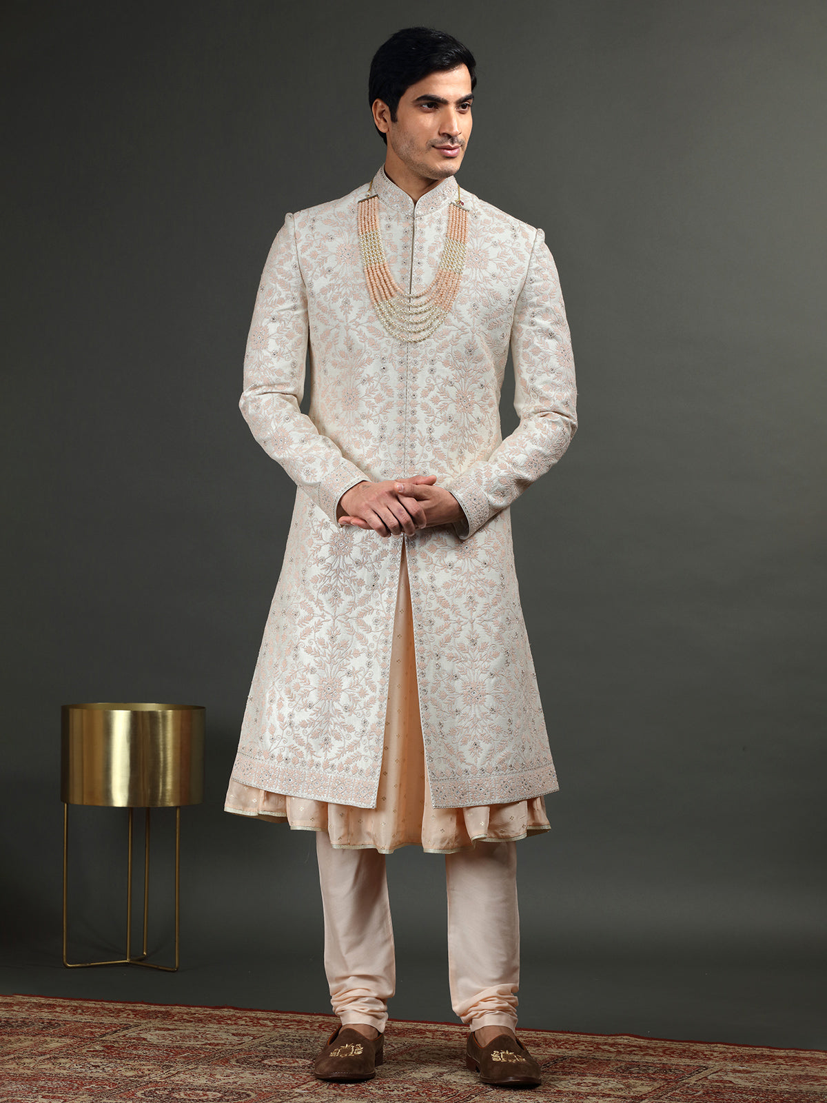 Cream and peach groom sherwani in raw silk