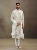 Cream silk peshwai groom sherwani with dupatta