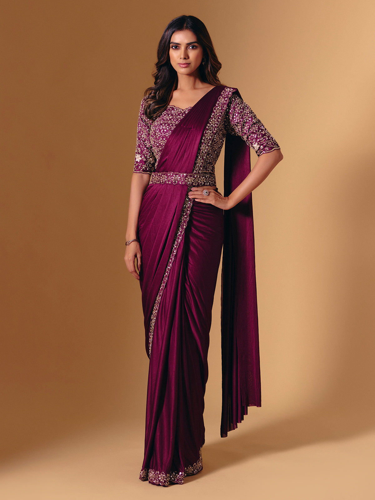 Dark purple lycra saree with shimmering cutdana design