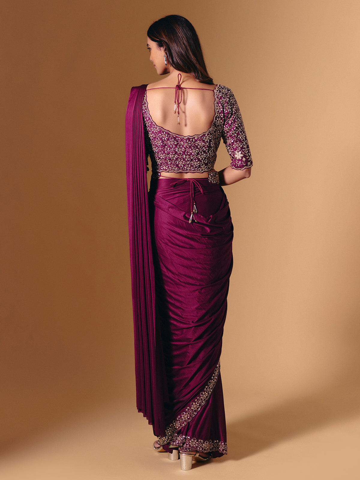 Dark purple lycra saree with shimmering cutdana design