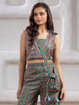 Green printed silk palazzo suit with pearls and mirrors