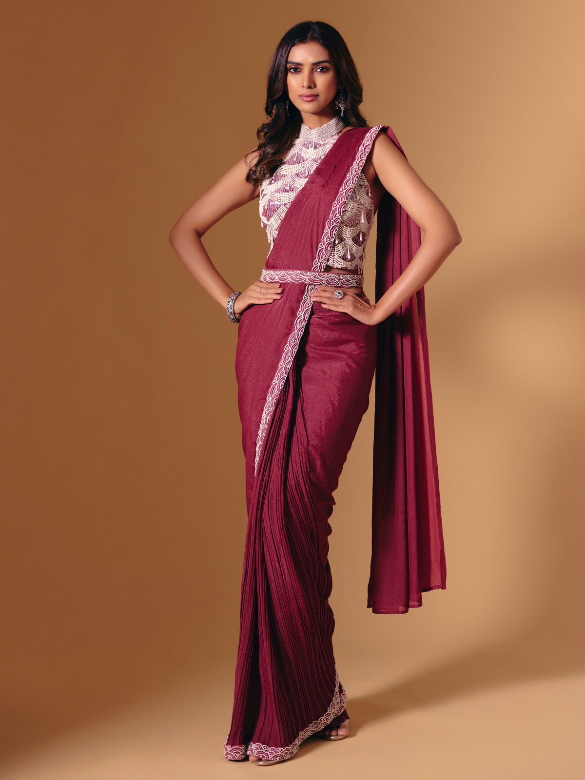 Maroon cruss lycra saree with sequins and pearl highlights