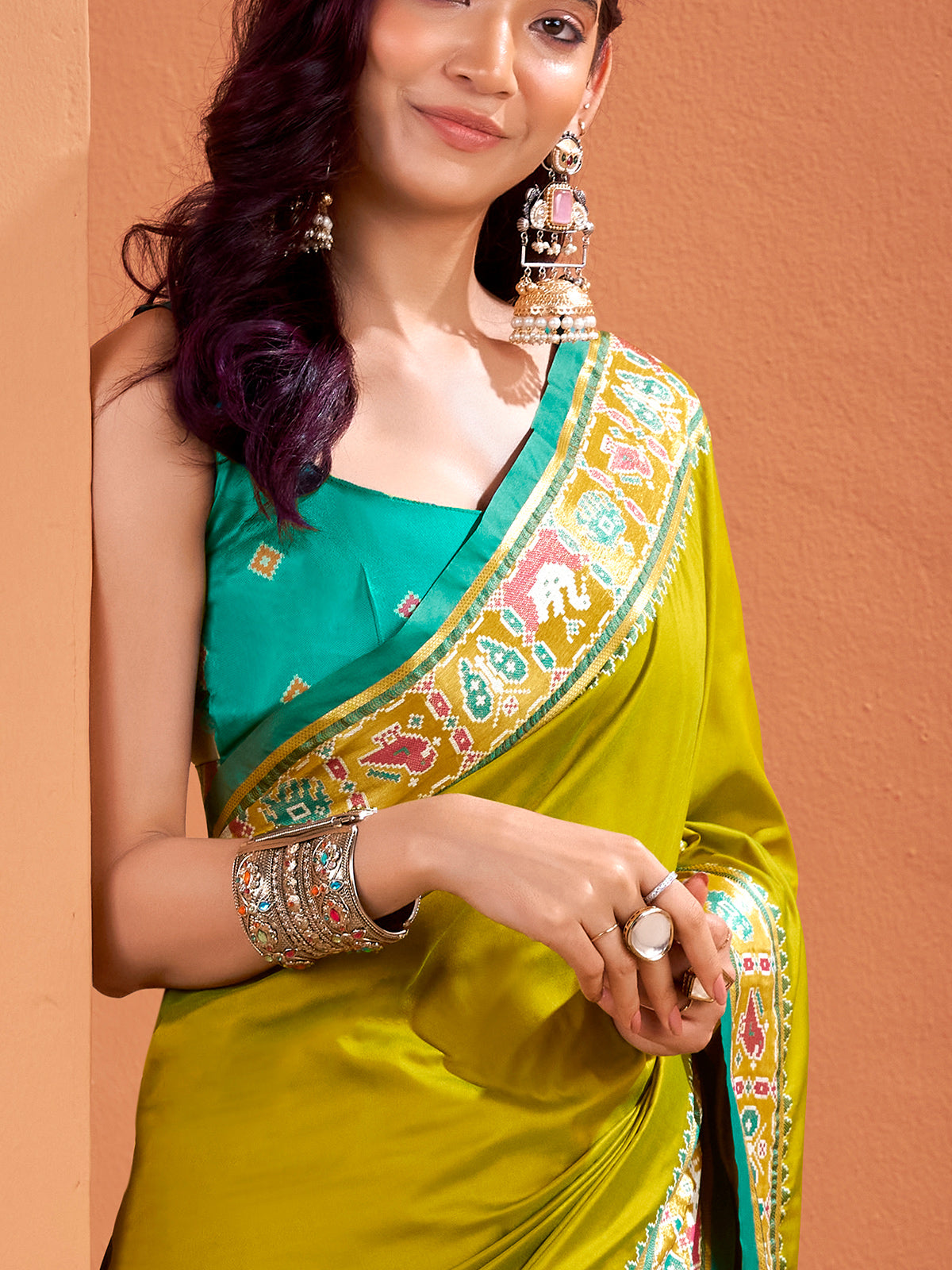 Mehendi green patola saree with traditional flair