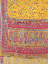 Mustard yellow modal silk saree with colorful motifs