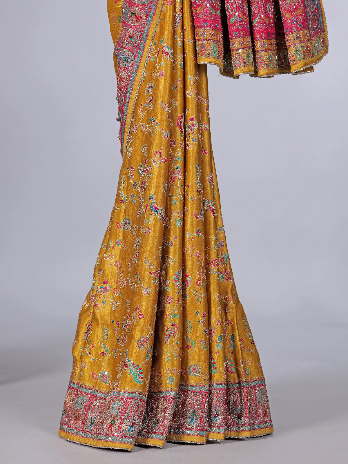 Mustard yellow modal silk saree with colorful motifs