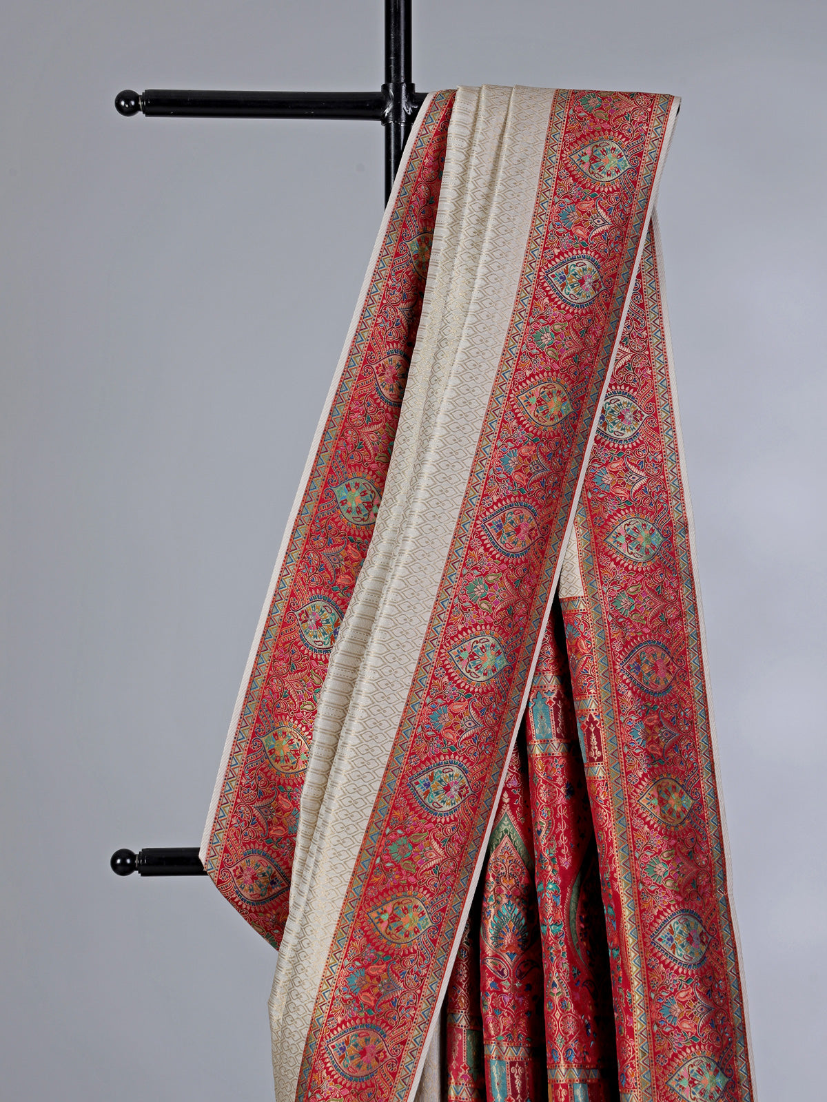 Off white dola silk saree with colorful motifs
