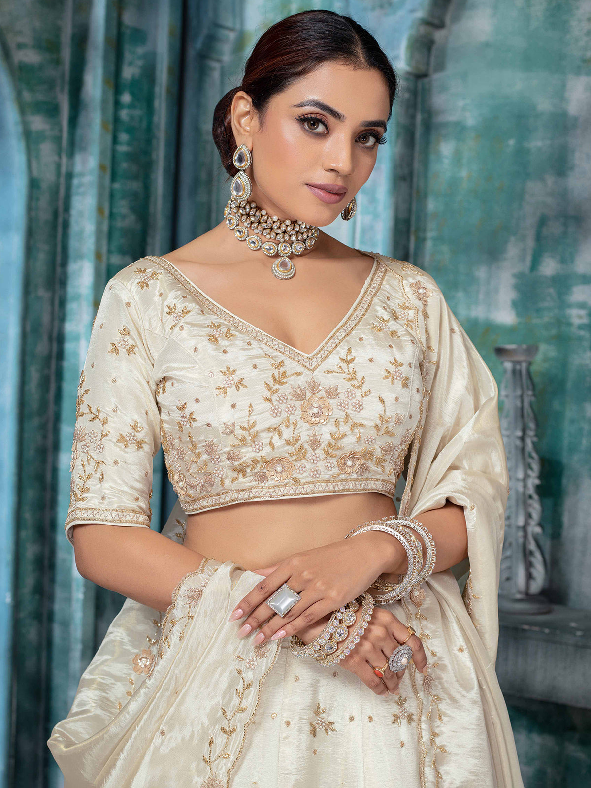 Off white tissue silk lehenga choli with pearls
