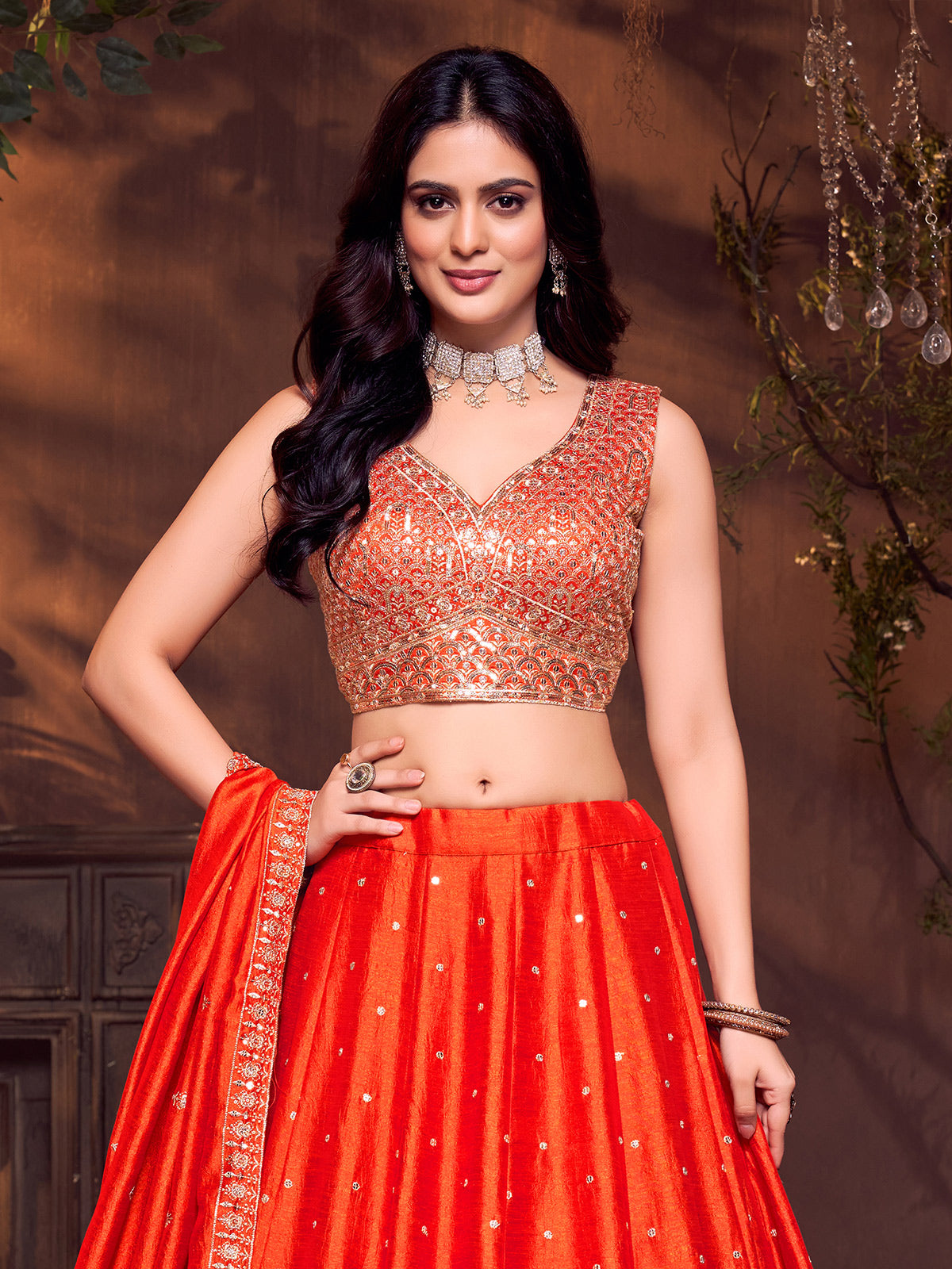 Orange silk sweetheart neck embellished lehenga choli