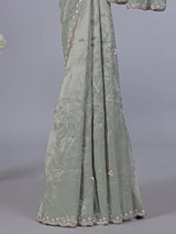 Pista green soft tissue silk saree for reception wear