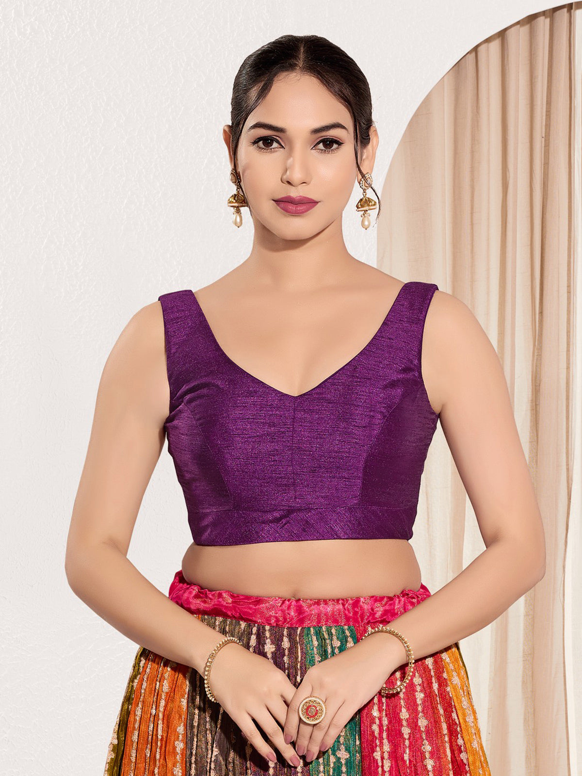 Purple silk round neck sleeveless festive blouse
