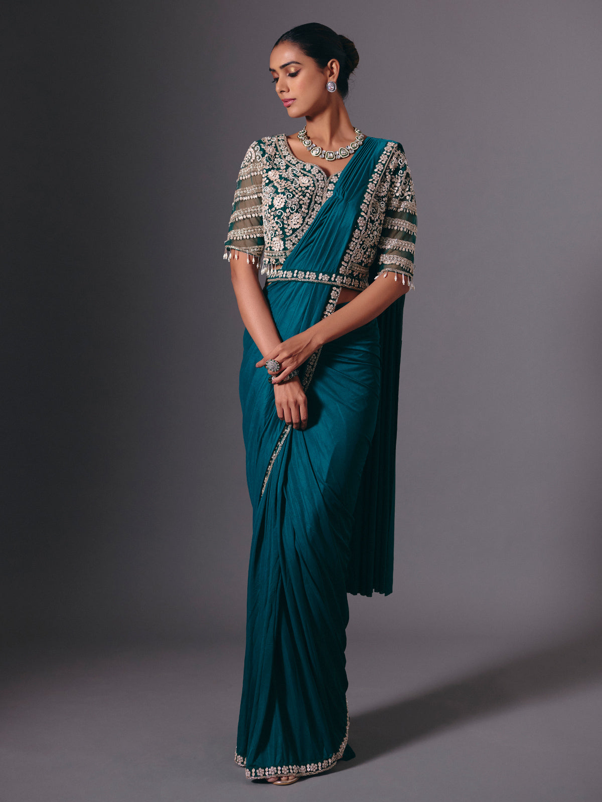 Rama green lycra saree with heavy work detailing