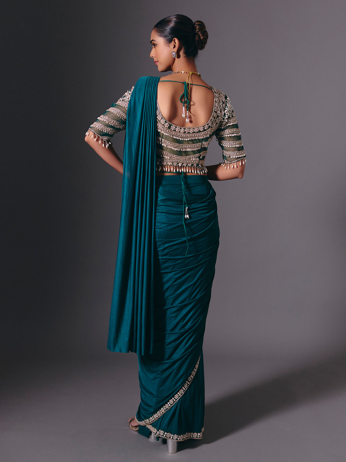 Rama green lycra saree with heavy work detailing