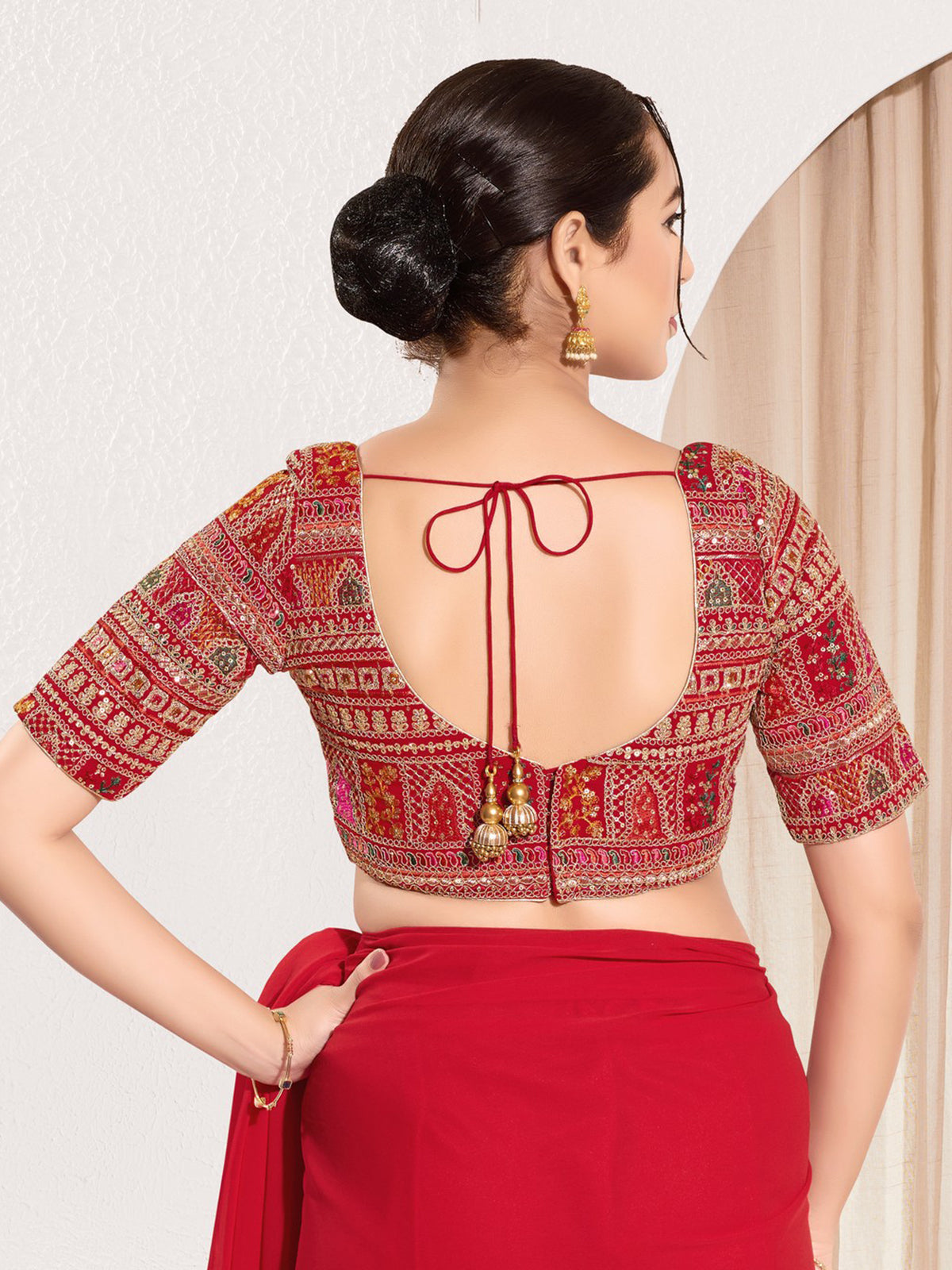 Red brocade blouse with embroidery and sequins work