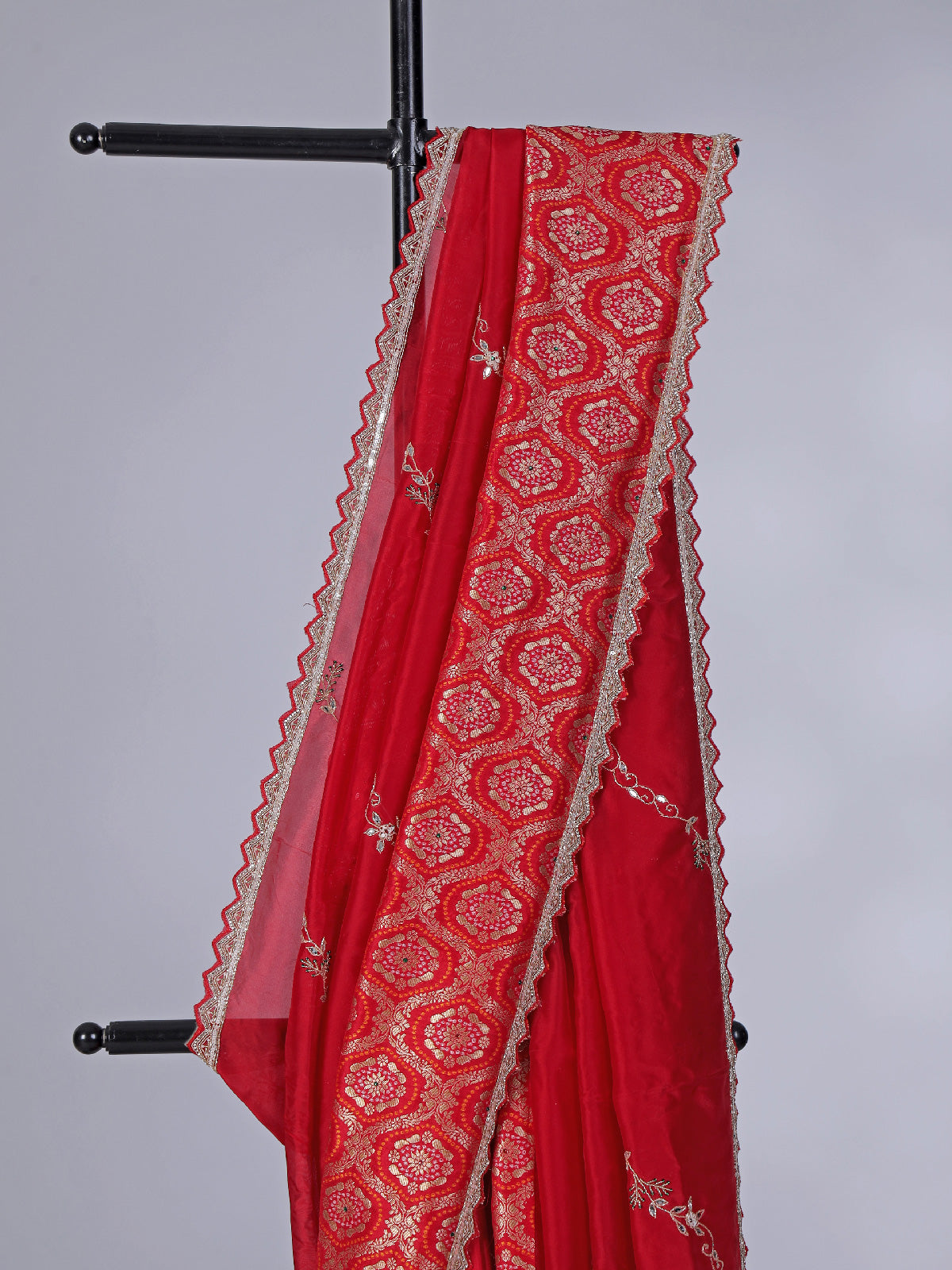 Red dola silk saree with sparkling festive embellishments