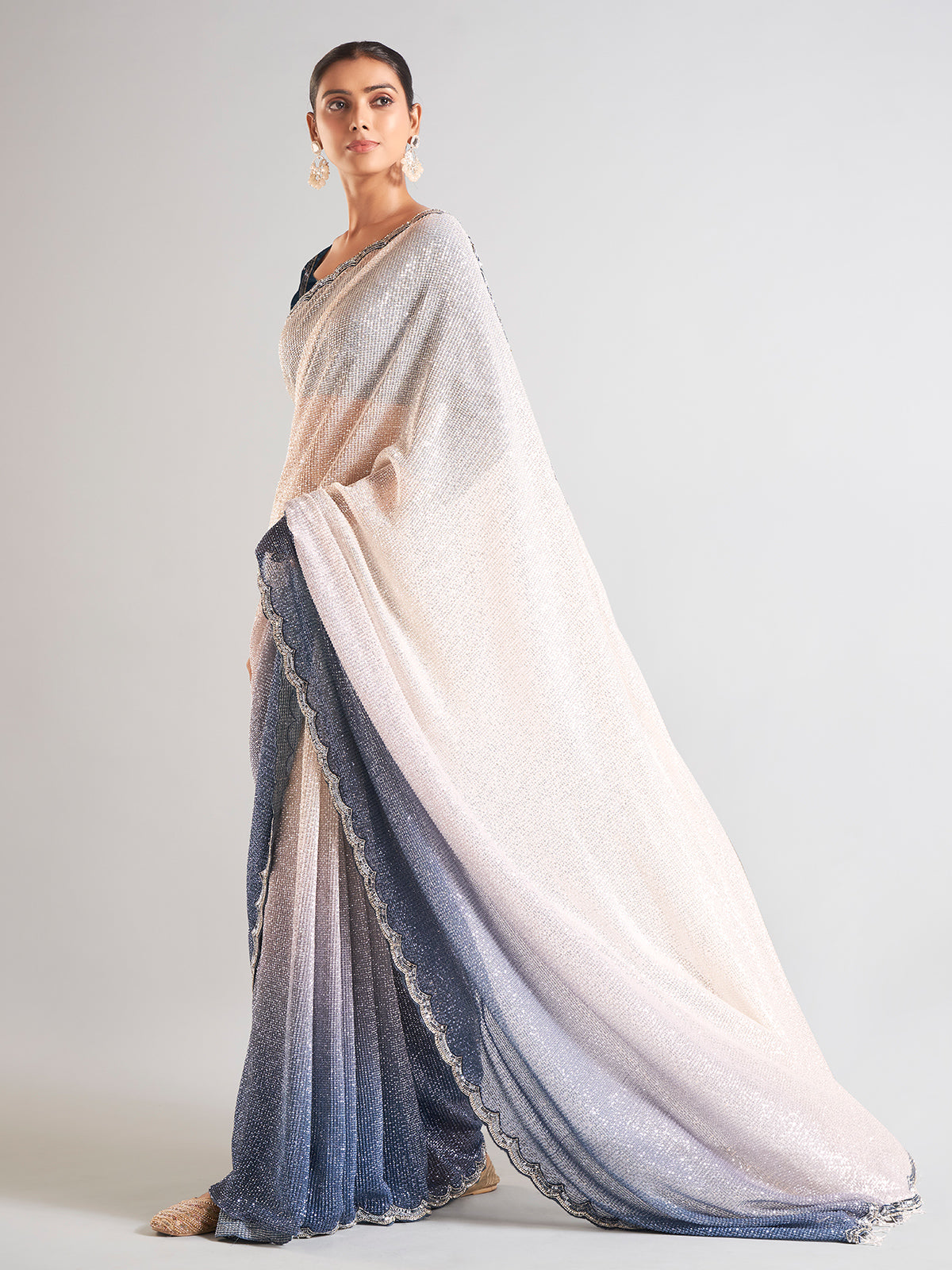 Cream and blue sequins saree