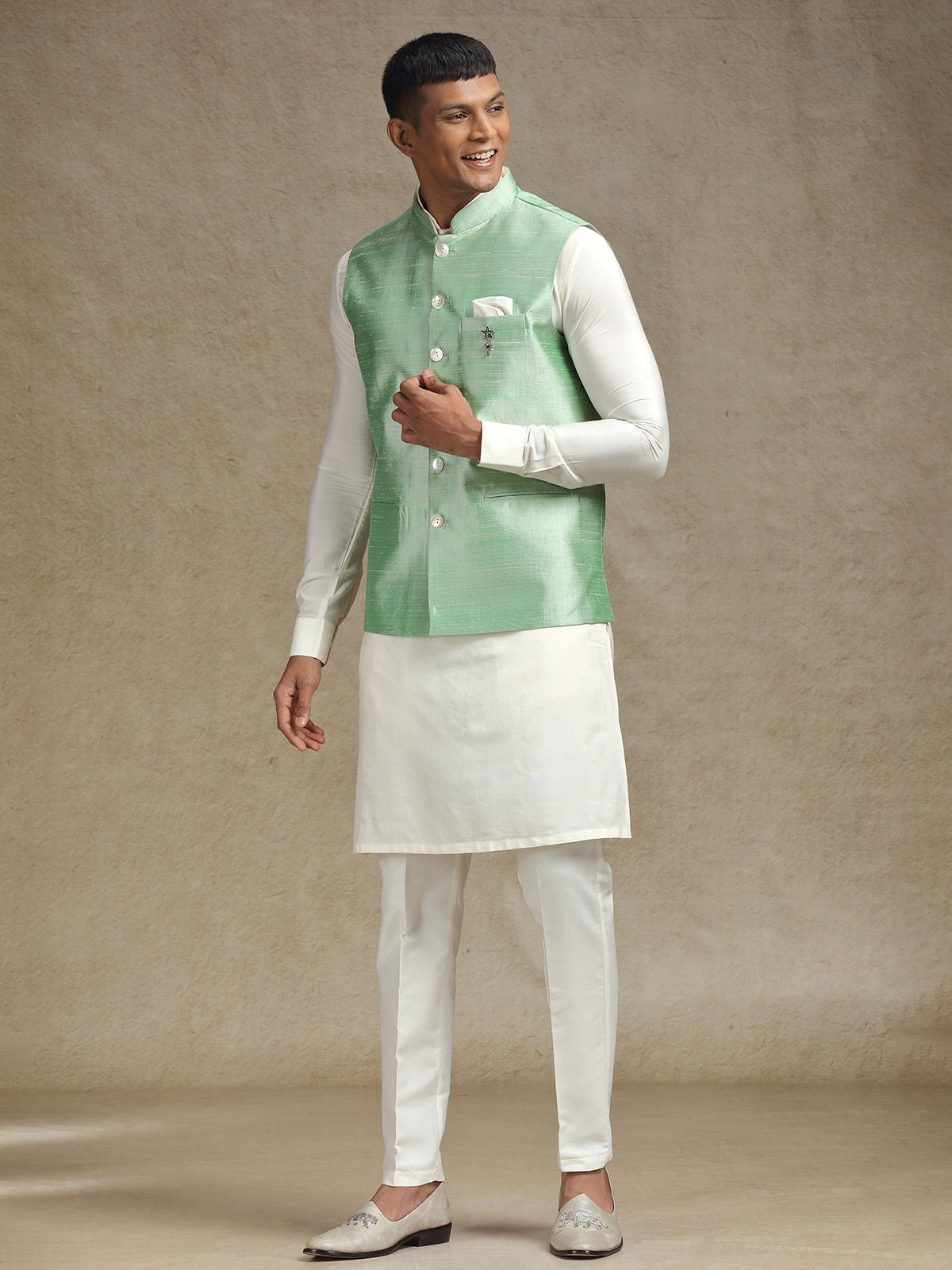 White and light green waistcoat set with intricate embroidery