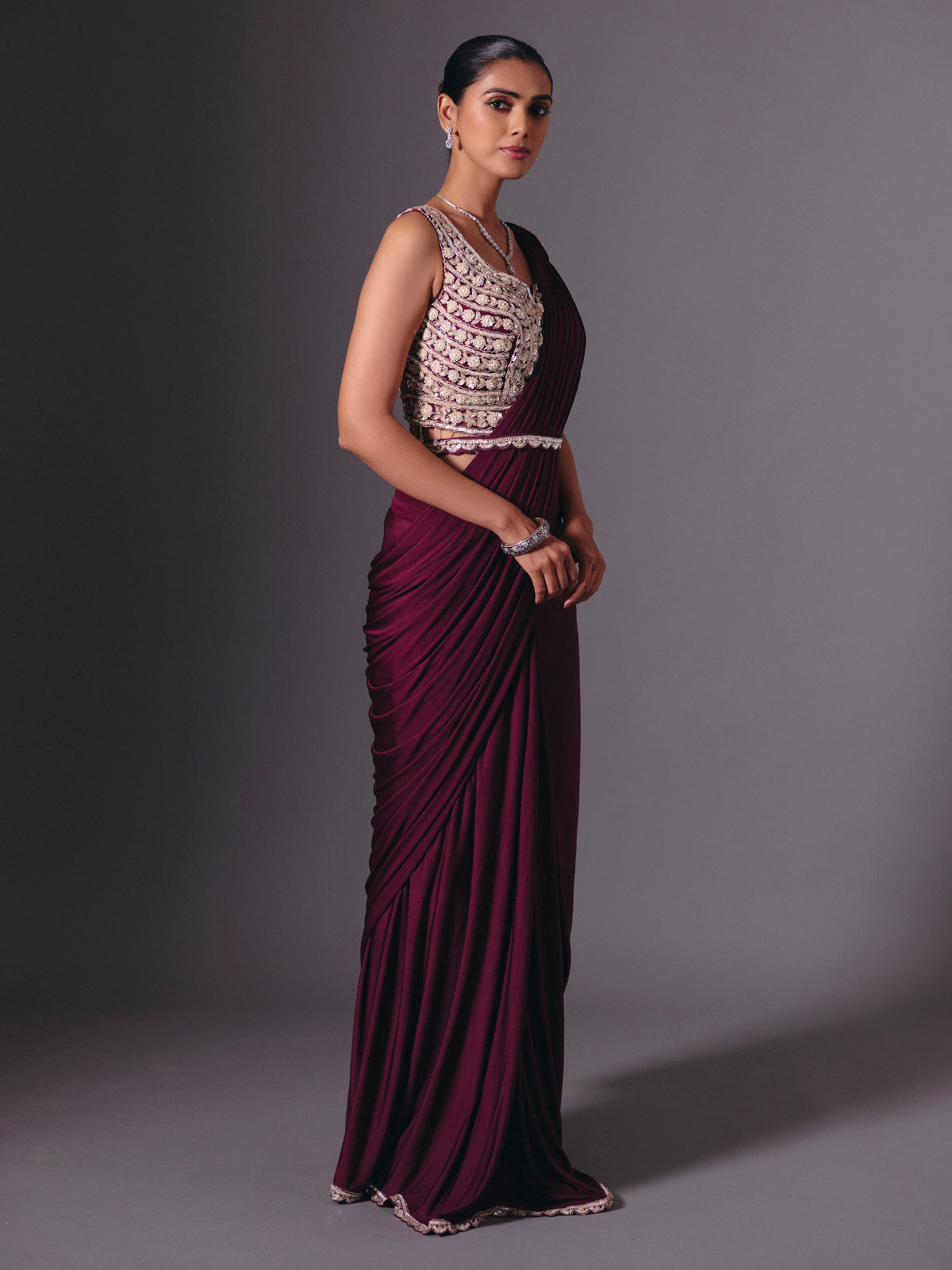 Wine lycra saree with sparkling cutdana and pearl work