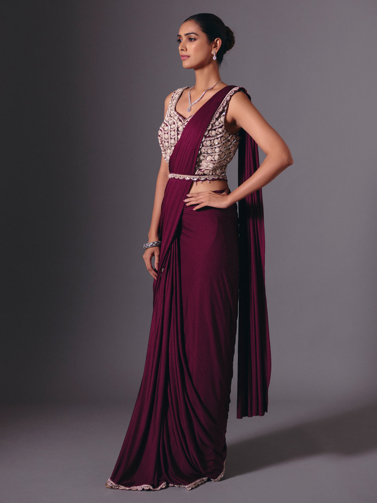 Wine lycra saree with sparkling cutdana and pearl work