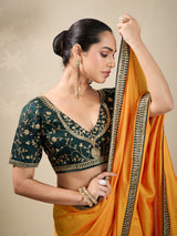 Yellow plain silk saree with green blouse