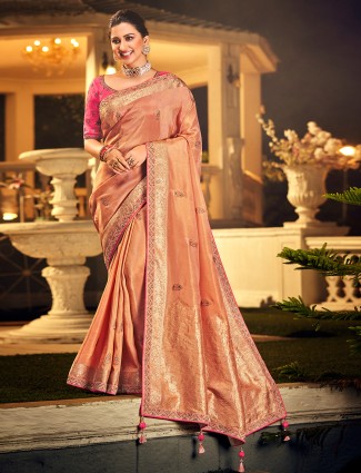 Attirable peach wedding occasions dola silk saree