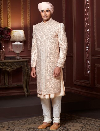 Beige hued raw silk sherwani for wedding event