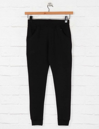 Black colored cotton solid jeggings