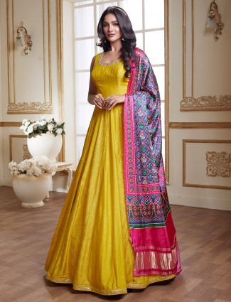 Bright yellow floor-length raw silk anarkali suit for wedding event