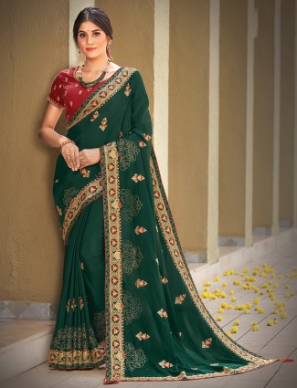 Classy dark green silk saree for wedding events