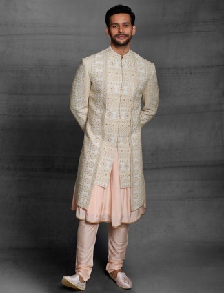 Cream hue silk wedding wear men sherwani