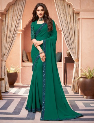 Elegant dark green festive and party georgette saree