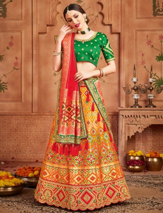 Extravagant orange patola silk unstitched lehenga choli for wedding event