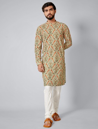 Green color festive special printed cotton silk kurta suit