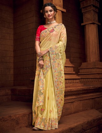 Light yellow extravagant tissue silk saree for wedding look