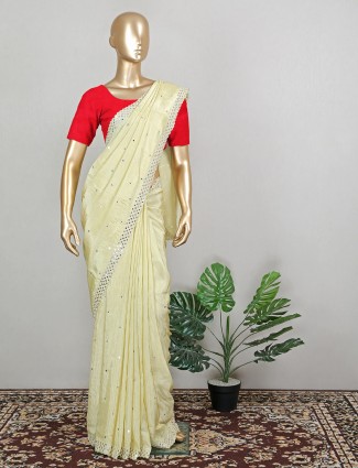 Trendy pale yellow silk saree for wedding seasons